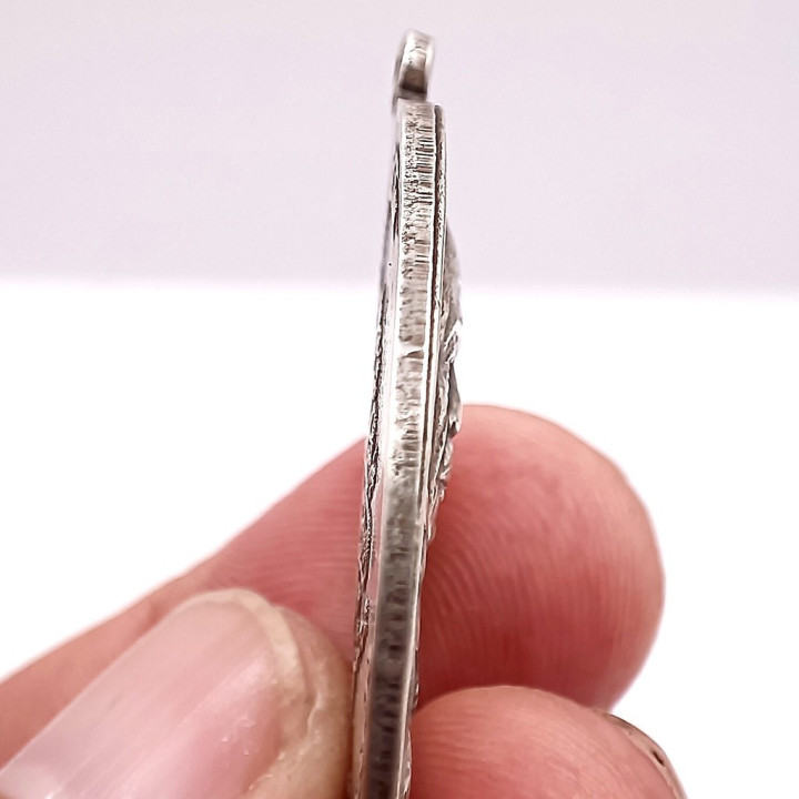 Luang Pu Tim Isariko Silver Amulet Coin